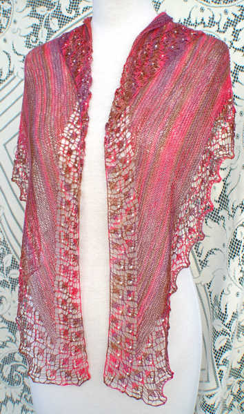 Shallow Tri Shawl worn in traditional triangle shawl style with front tails left hanging