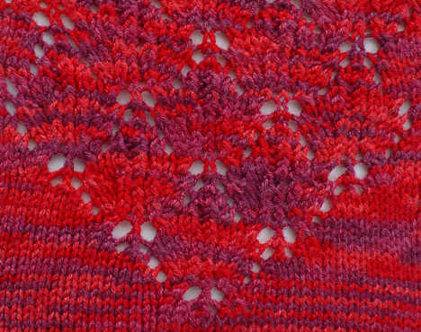 detail stitch pattern from Lace Maple Leaf Socks, shown in Crystal Palace Panda Silk color 4011 Cranberry Tones