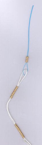 stringing beads using a nylon floss threader